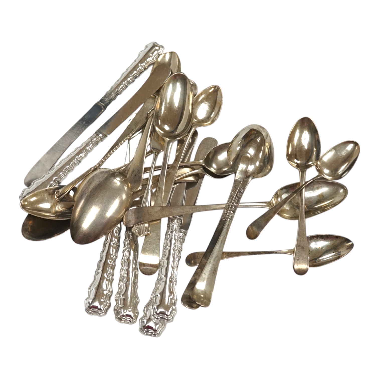 Sixteen assorted items of silver flatware, including mainly 19th century spoons, 9.2oz, together with a set of six later silver handled tea knives. Condition - Poor to fair